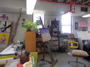Other artist spaces include easels, shelves of books that are donated, even a handmade coat rack on which some artists have turned old canvases into lovely and unique purses.